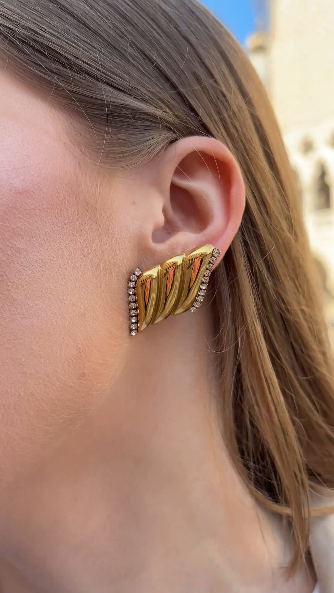 Close-up of gold-plated Angelia earrings