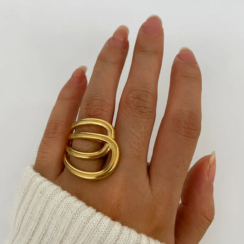 Modern sculptural statement ring bold curved design