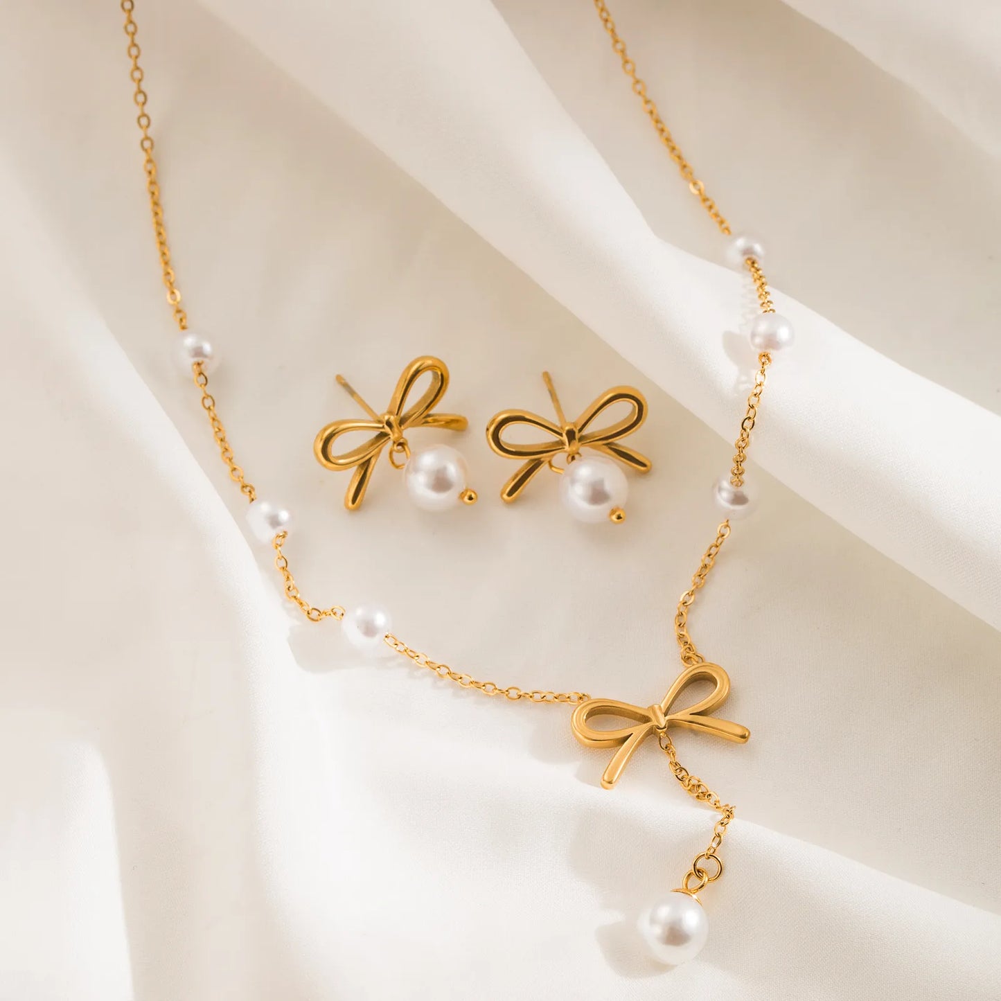 Aurora gold-plated bow pearl necklace and earrings set
