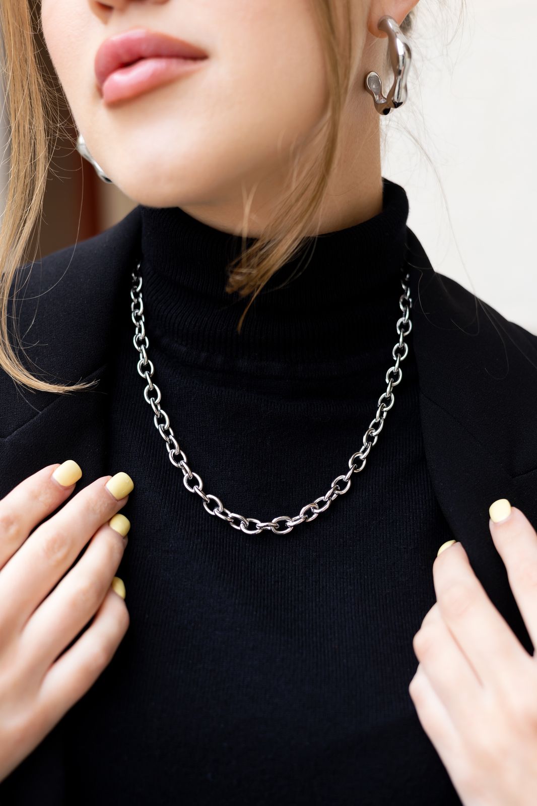 Close-up of freshwater pearls on chunky stainless steel chain