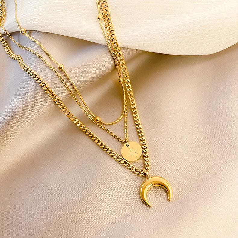 Delicate gold plated Y-necklace with moon and star pendant